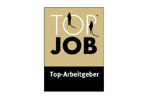 Gold-schwarzes Abzeichen mit den Texten Top Job und Top-Arbeitgeber, darüber zwei Silhouetten.