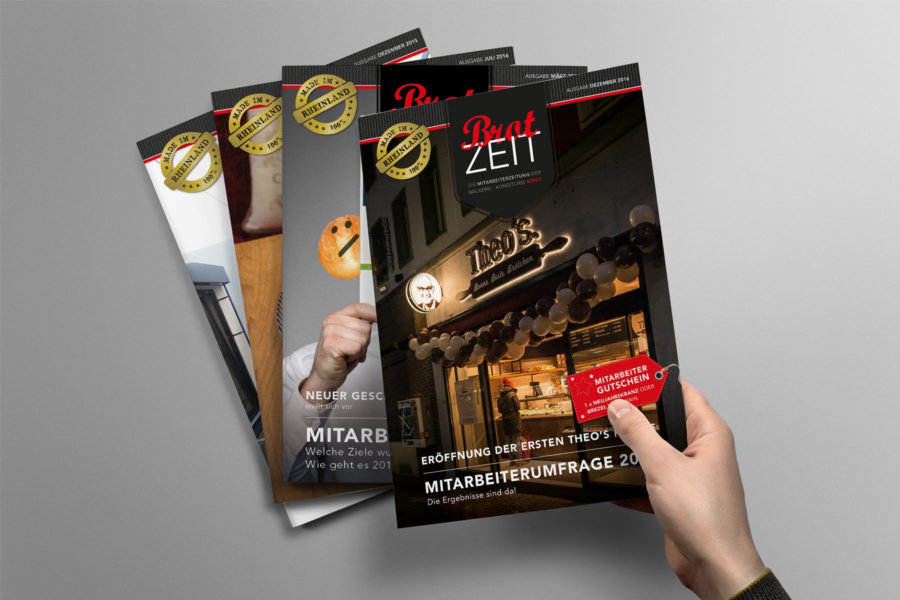 Eine Hand hält eine deutsche Zeitschrift mit dem Titel Brotzeit, darunter drei weitere Ausgaben.
